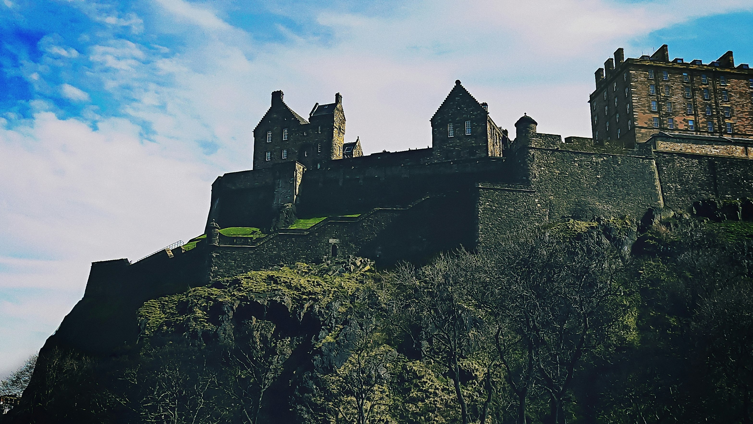 brown concrete castle on cliff during daytime